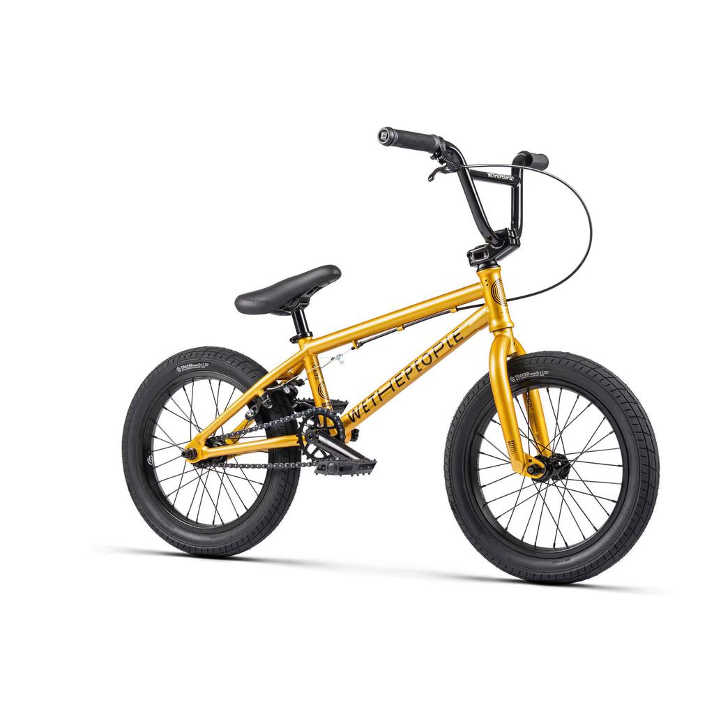 The Wethepeople Seed 16 Inch Bike is a yellow BMX designed for young riders, featuring a black seat and handlebars with thick tires.
