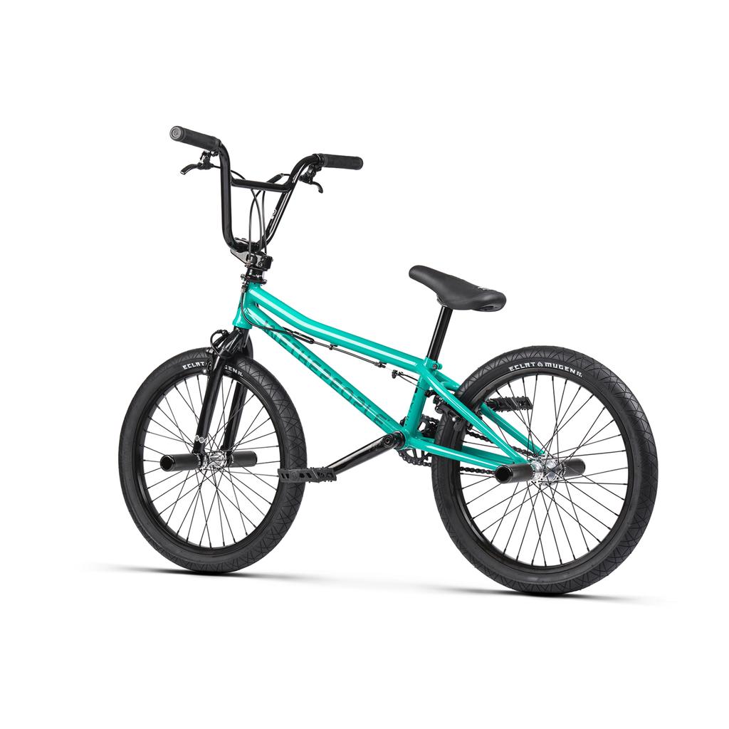The Wethepeople Sinus Flatland 20 Inch Bike in teal and black features front and rear pegs, flatland-specific Mugen tires, and a hybrid freecoaster hub, displayed against a white background.