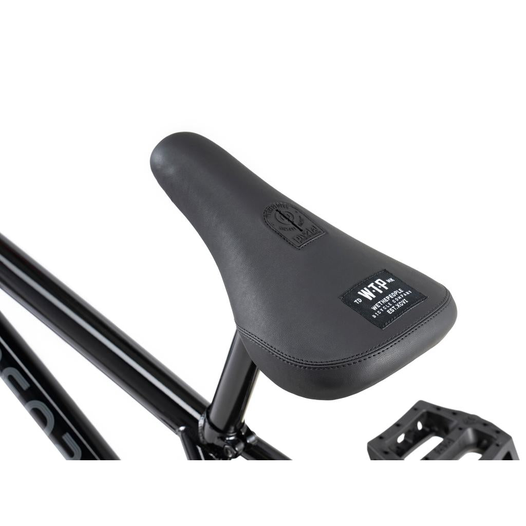 Close-up of a black seat with branding on a Wethepeople Sinus Flatland 20 Inch Bike, attached to the flatland frame.