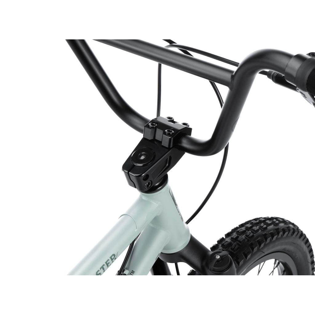 Close-up view of the Wethepeople Swampmaster 20 Inch Bike’s handlebars, stem, and front wheel, highlighting detailed components and cables.