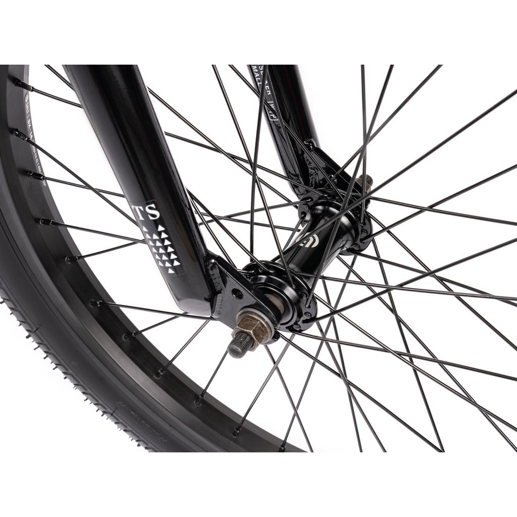 Close-up view of the Wethepeople Thrillseeker 20 Inch Bike wheel, featuring its black rim, spokes, tire, and hub against a white background.