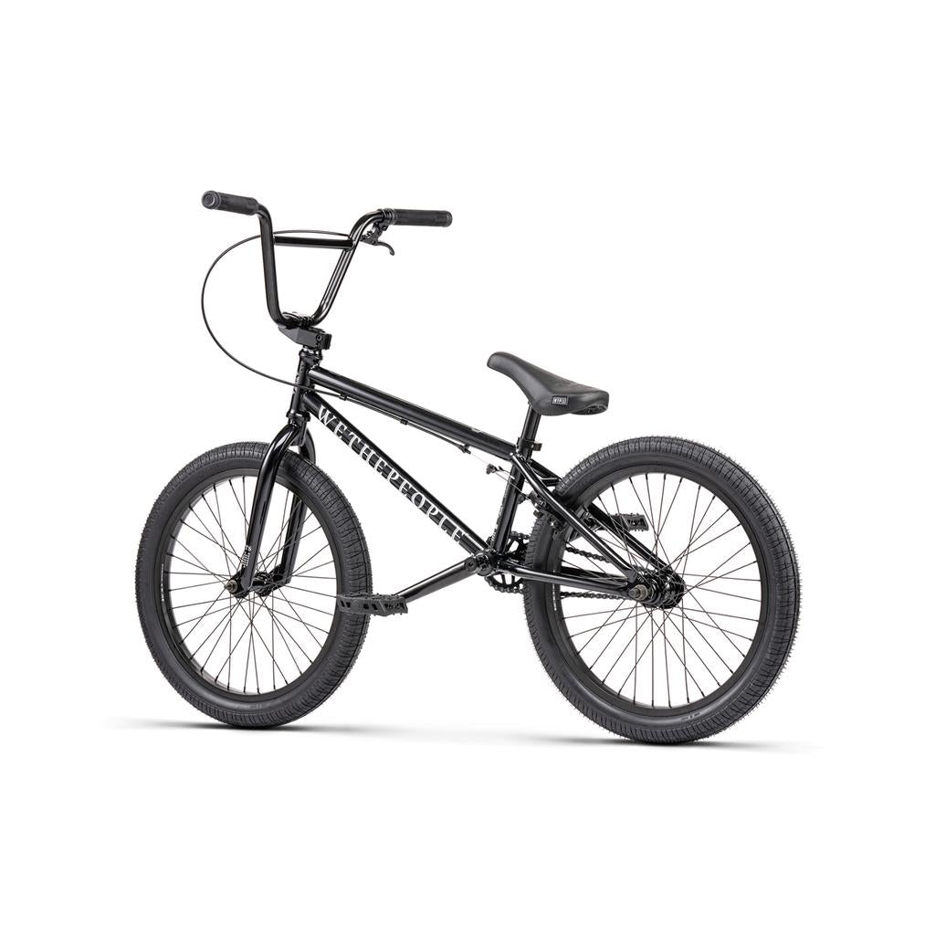 A black Wethepeople Thrillseeker 20 Inch Bike featuring thick tires, a padded seat, and "WETHEPEOPLE" branding on the frame, displayed against a white background.