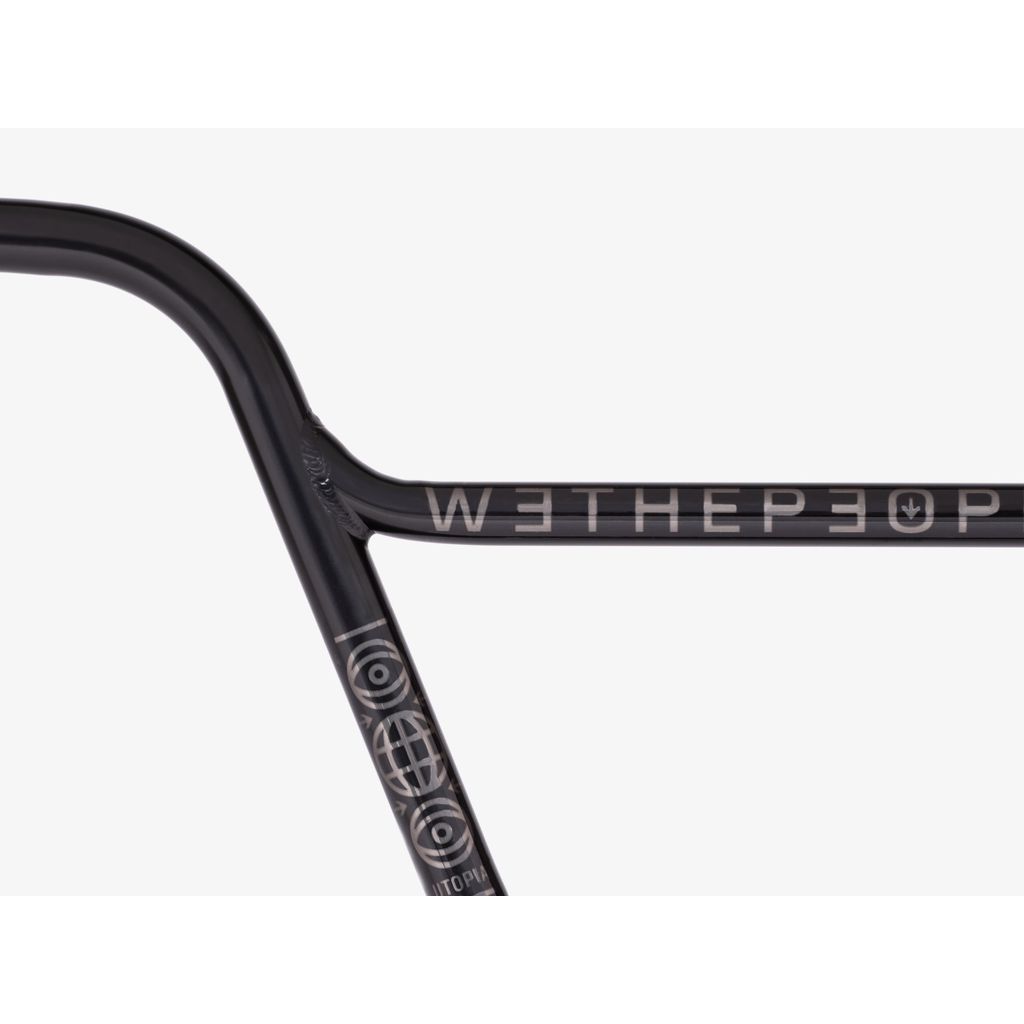 Close-up of a Wethepeople Utopia Flatland Handlebar in black featuring "WETHEPEOPLE" text and graphics, ideal for riders looking for the perfect experience.