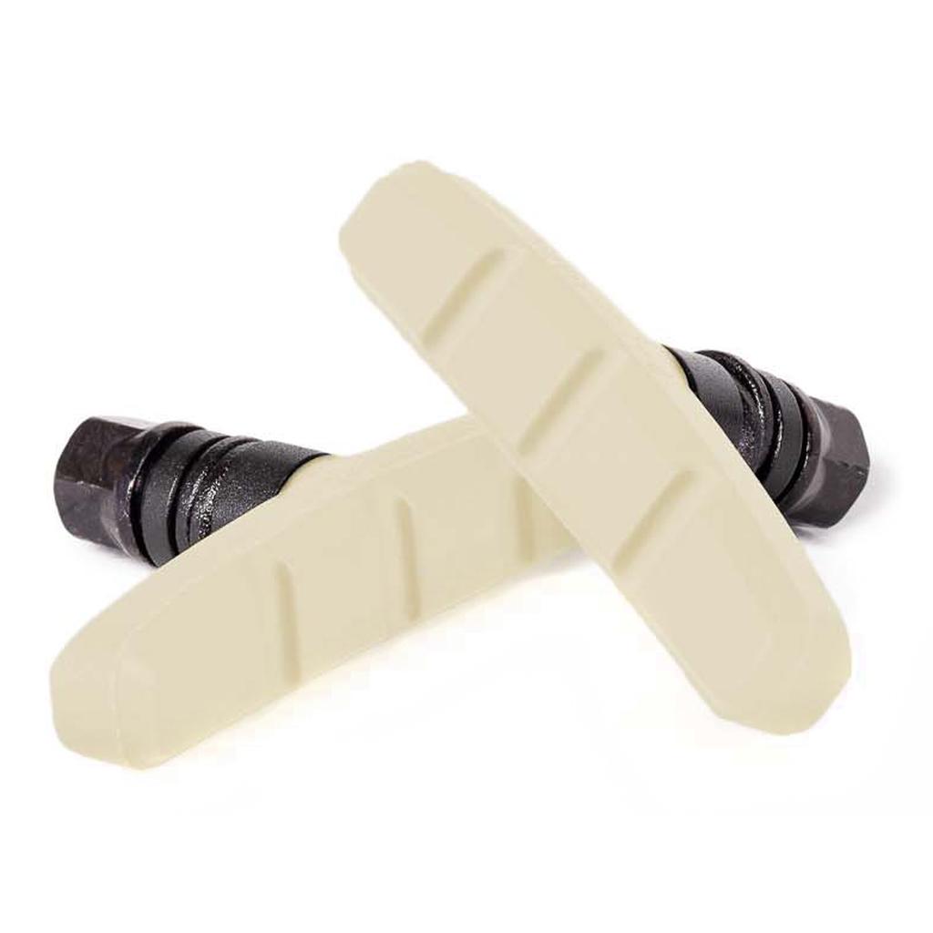 Two Salt AM Brake Shoes in white, featuring black metal attachments, are arranged in an X shape on a white background, highlighting their effective brake pad compound for dependable stopping power.