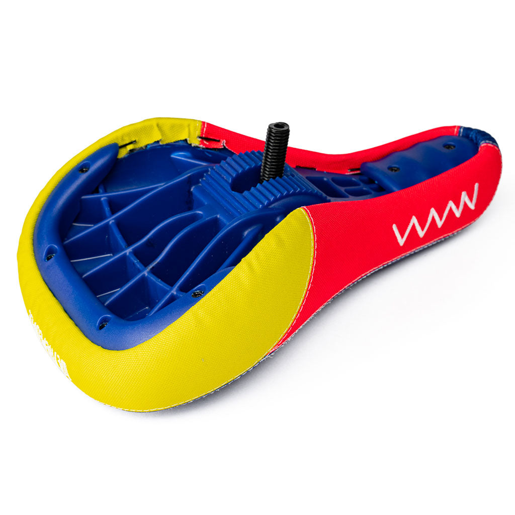 A red, yellow and blue Wethepeople Team Seat (Dan Banks) inflatable raft on a white background.