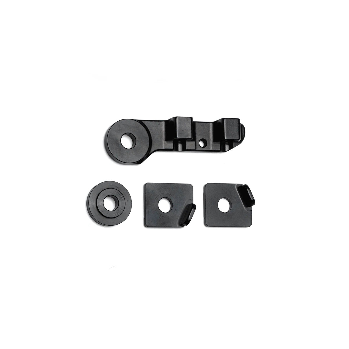 The DK Zenith Disc Frame Flat Mount Brake/Axle Hardware Kit is displayed on a white background, featuring four black metal mounting pieces: one DK Zenith bracket with two holes, two rectangular plates with angled tabs for disc brake hardware setups, and one round washer.