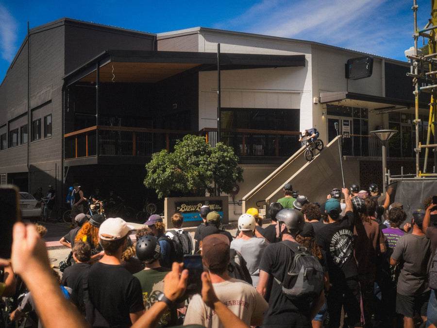 A rider airs the stairs in West End with the King Of BNE 2026 crowd watching