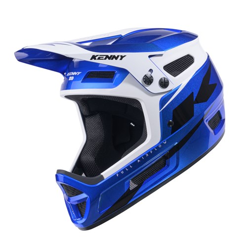 The Kenny Racing Elite Helmet Candy Blue + Glitter & Varnish is a lightweight, full-face BMX helmet featuring blue and white colors with black accents, a front visor, ventilation panels, and the “KENNY” logo on top; it delivers superior protection and style for BMX race helmet enthusiasts.