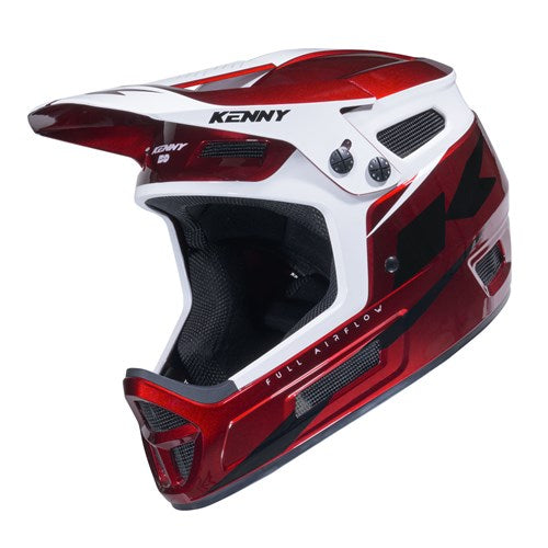 Kenny Racing Elite Helmet Candy Red + Glitter & Varnish is a red and white full-face motocross helmet featuring a visor, ventilation grills, and “KENNY” branding on the top and side.