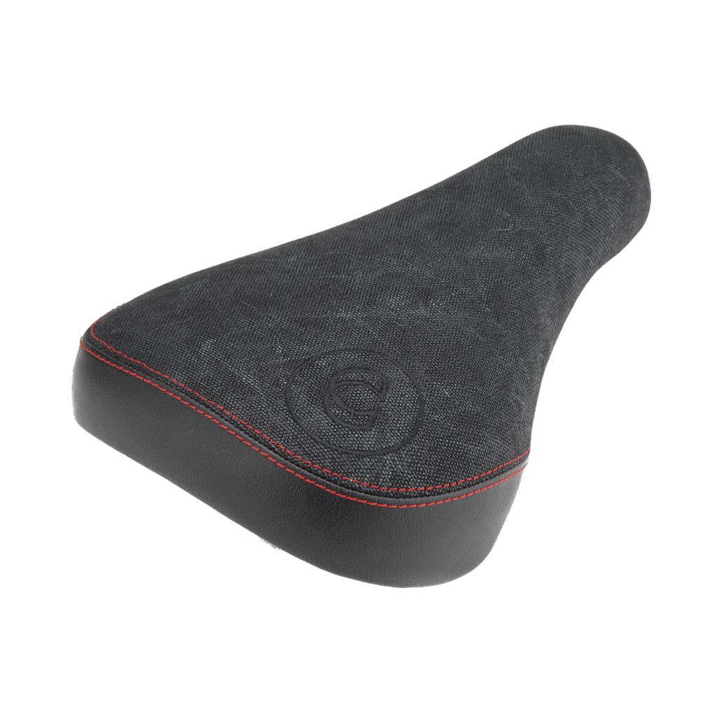 A Cinema Waxed Stealth Pivotal Seat featuring a textured faux leather black cover, accented with red stitching and a circular emblem.