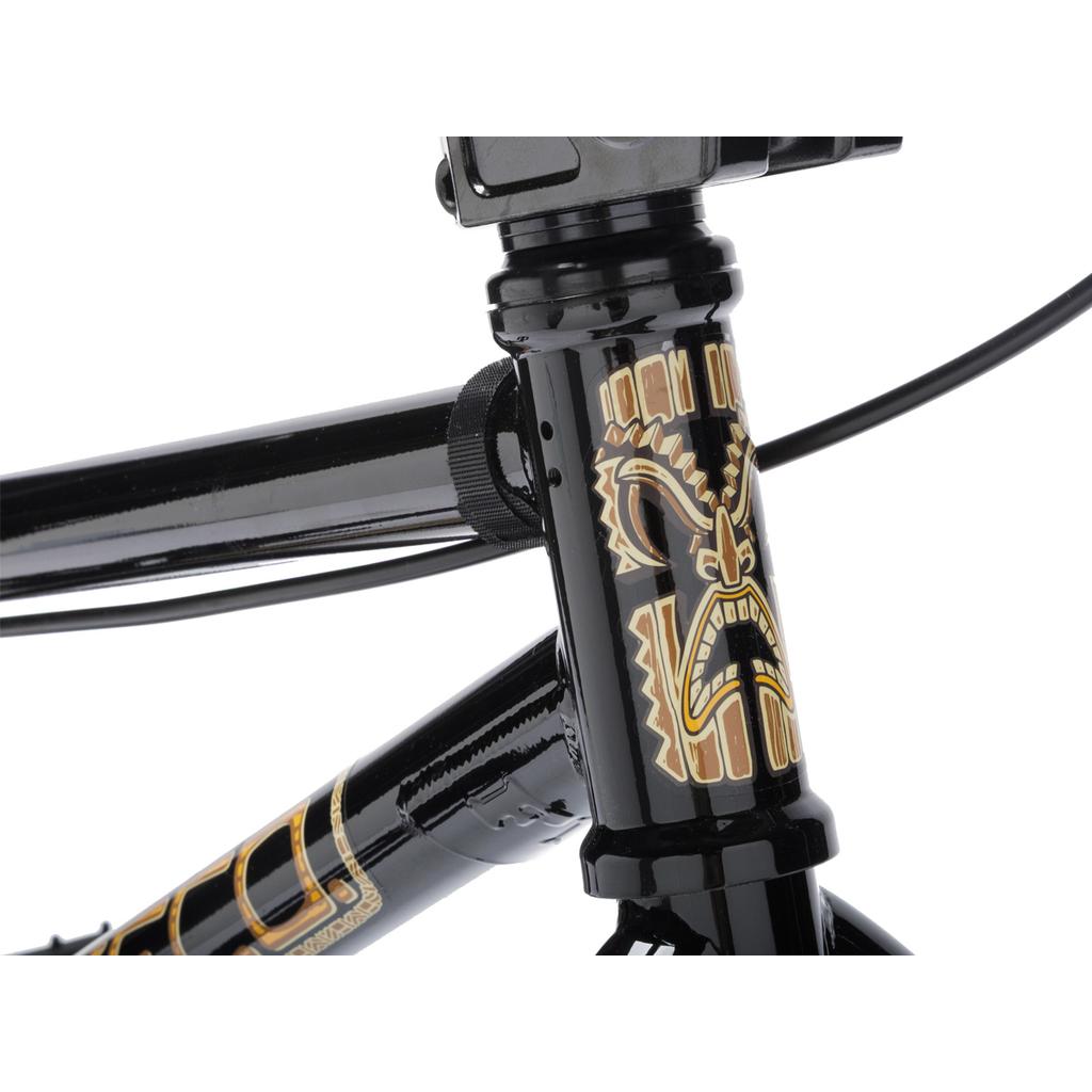 Close-up of a Fit Bike Co Misfit 16 kids BMX bike frame in black, featuring a decorative gold and brown stylized face graphic on the head tube.