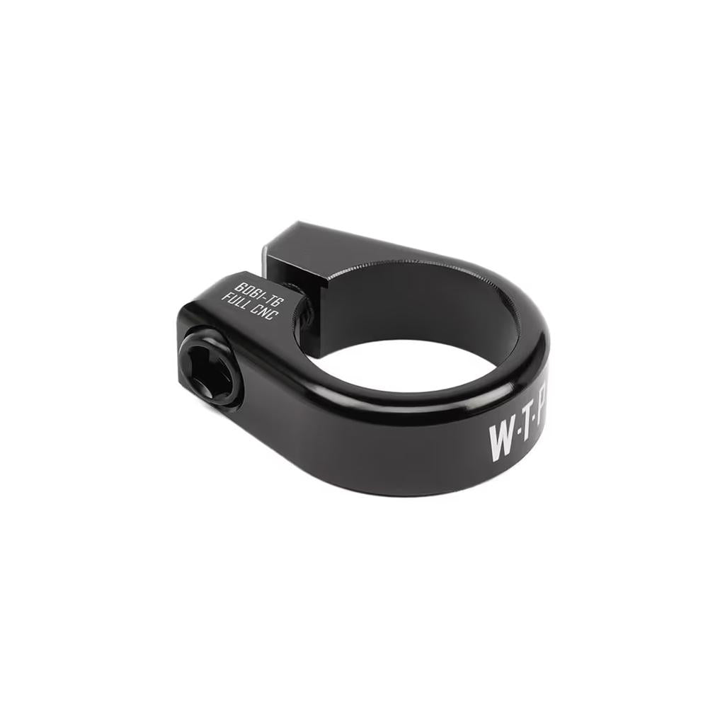 The black "Wethepeople Seat Post Clamp" fits 25.4mm seatposts and features a bolt, displaying "Eclat" and "W-TP." Made from durable 6061-T6 alloy, it offers strength and style for your ride.