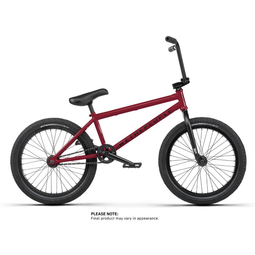 A Wethepeople Justice 20 Inch Bike in red, featuring black handlebars, seat, and tires, is shown in a stylish side view against a white background.