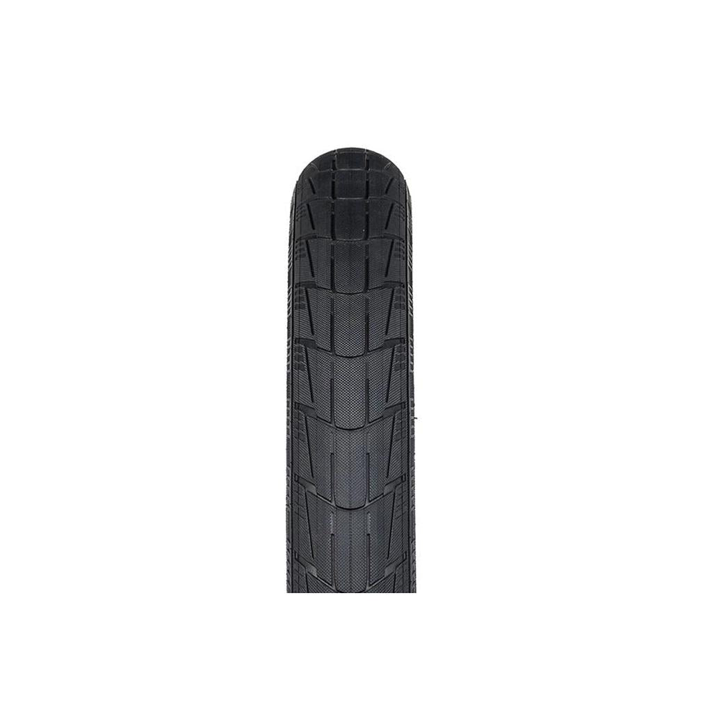 Close-up of a black tire tread pattern on a motorcycle or bicycle wheel, showcasing distinct grooves. The Eclat Mirage Folding Tyre features high-performance 120tpi casing and Silkshield protection for enhanced durability and reliable performance.