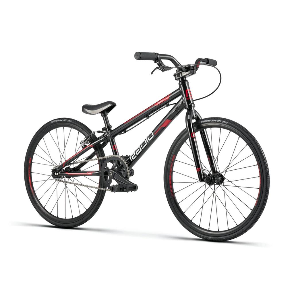 A Radio Cobalt Mini Bike in black and red, featuring thin tires, flat handlebars, and a small seat, is displayed on a white background.