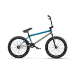 The Wethepeople Reason Shift 20 Inch Bike showcases a striking blue and black design with thick black tires, a cushioned seat, and durable handlebars. Its sturdy chromoly frame features a crossbar and rear wheel pegs for added thrill.