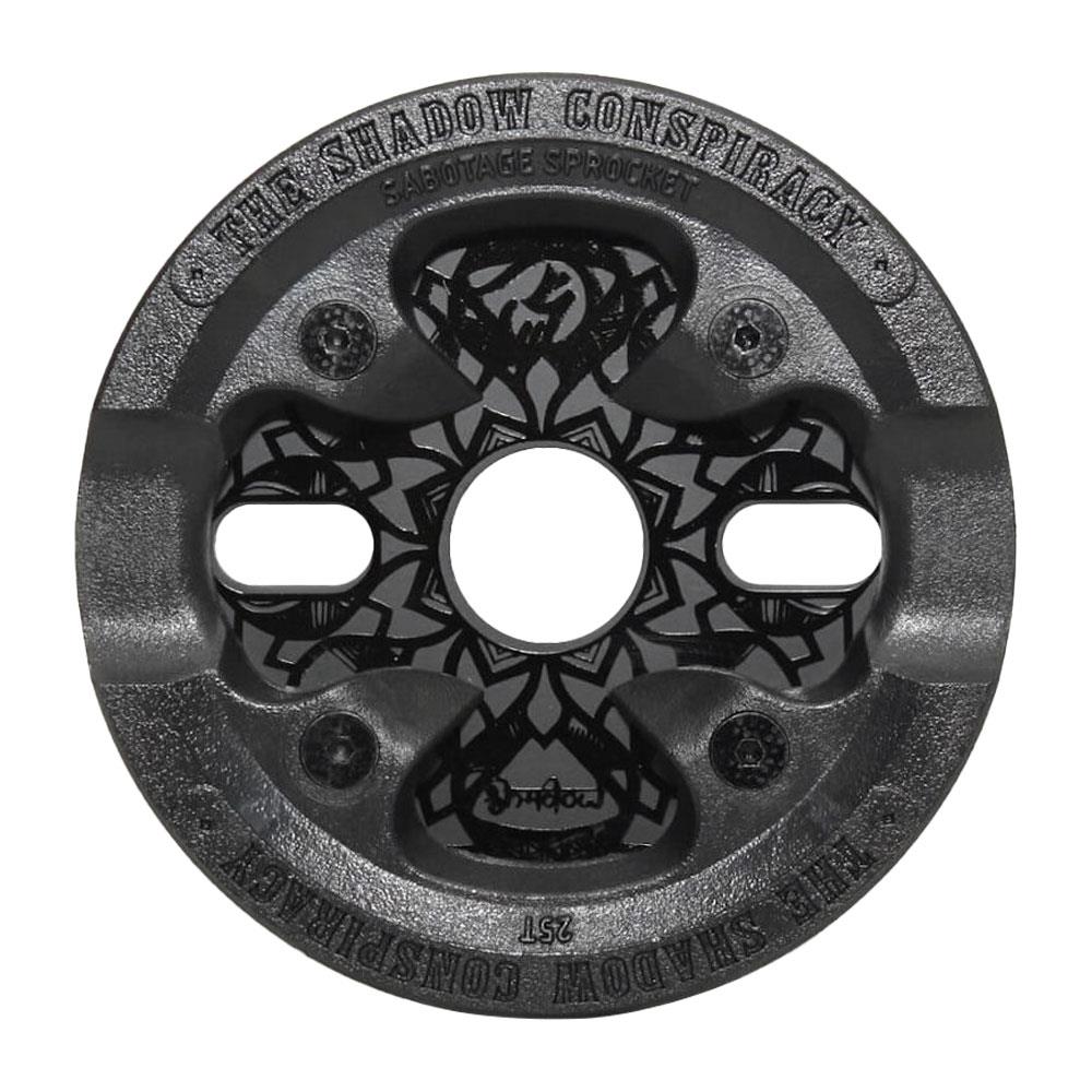 A black circular Shadow Sabotage Maya Edition V2 Sprocket BMX sprocket featuring a geometric pattern and “The Shadow Conspiracy Sabotage Sprocket” engraved around the edge.