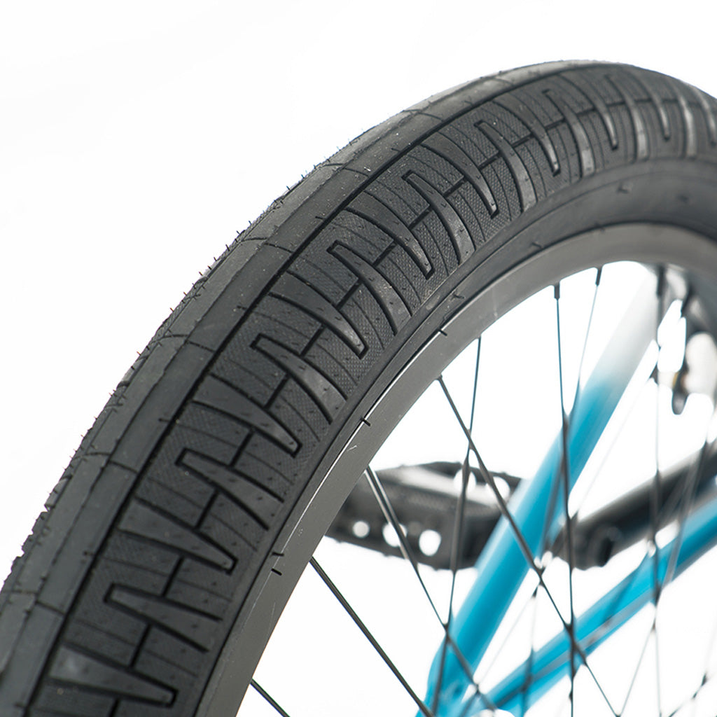 A Division Reark 20 inch blue bicycle tire on a white background.