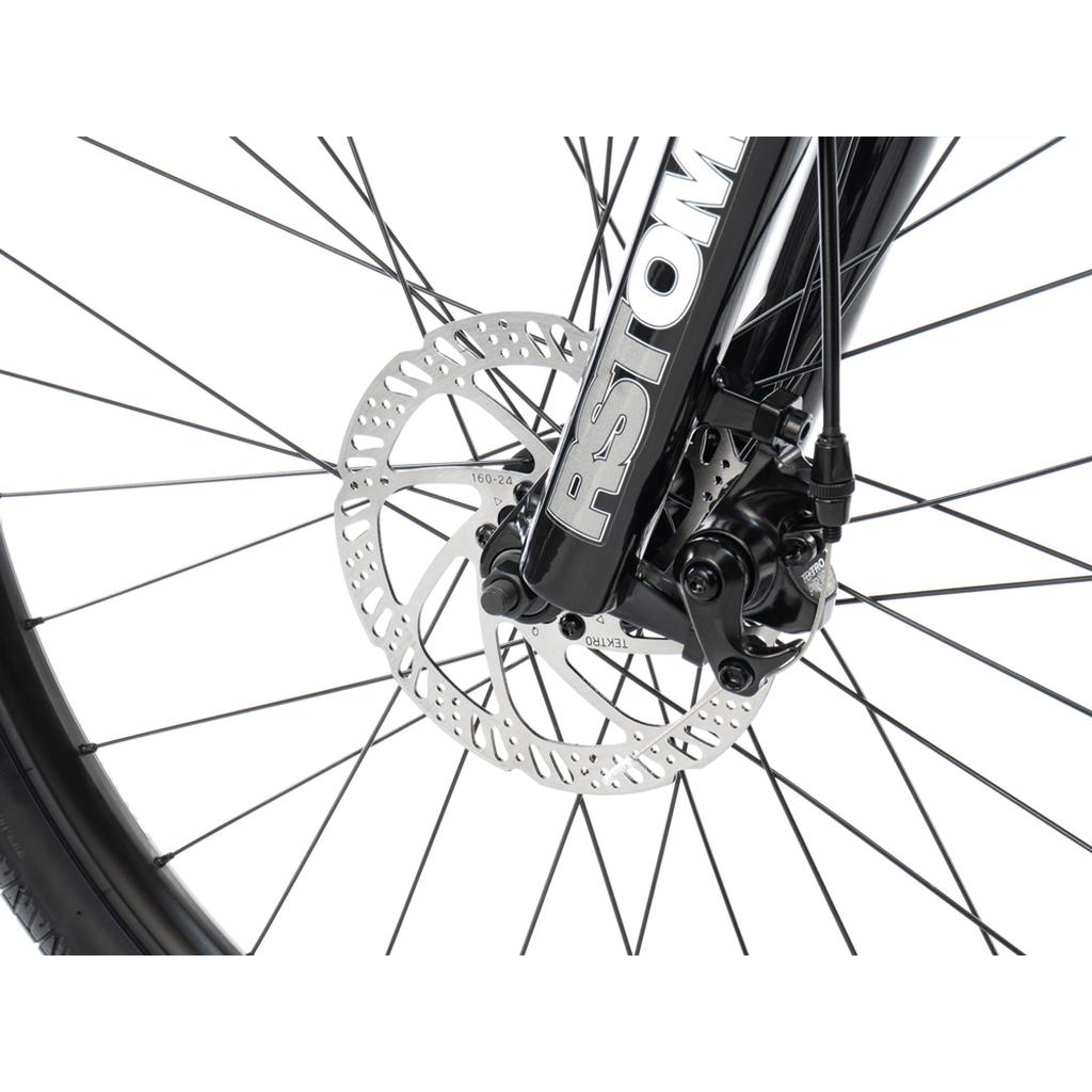 Close-up of the front wheel on the Radio Fiend 26 Inch Bike, highlighting its disc brake system, rotor, and spokes on a 6061-T6 alloy frame against a white background.