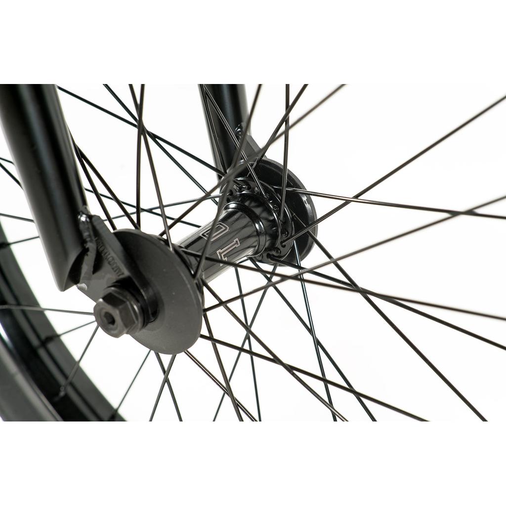 Close-up of the Colony Prody Pro 20 Inch Bike wheel hub, featuring black spokes, axle, and nuts against a white background—a tribute to classic mid school BMX style.