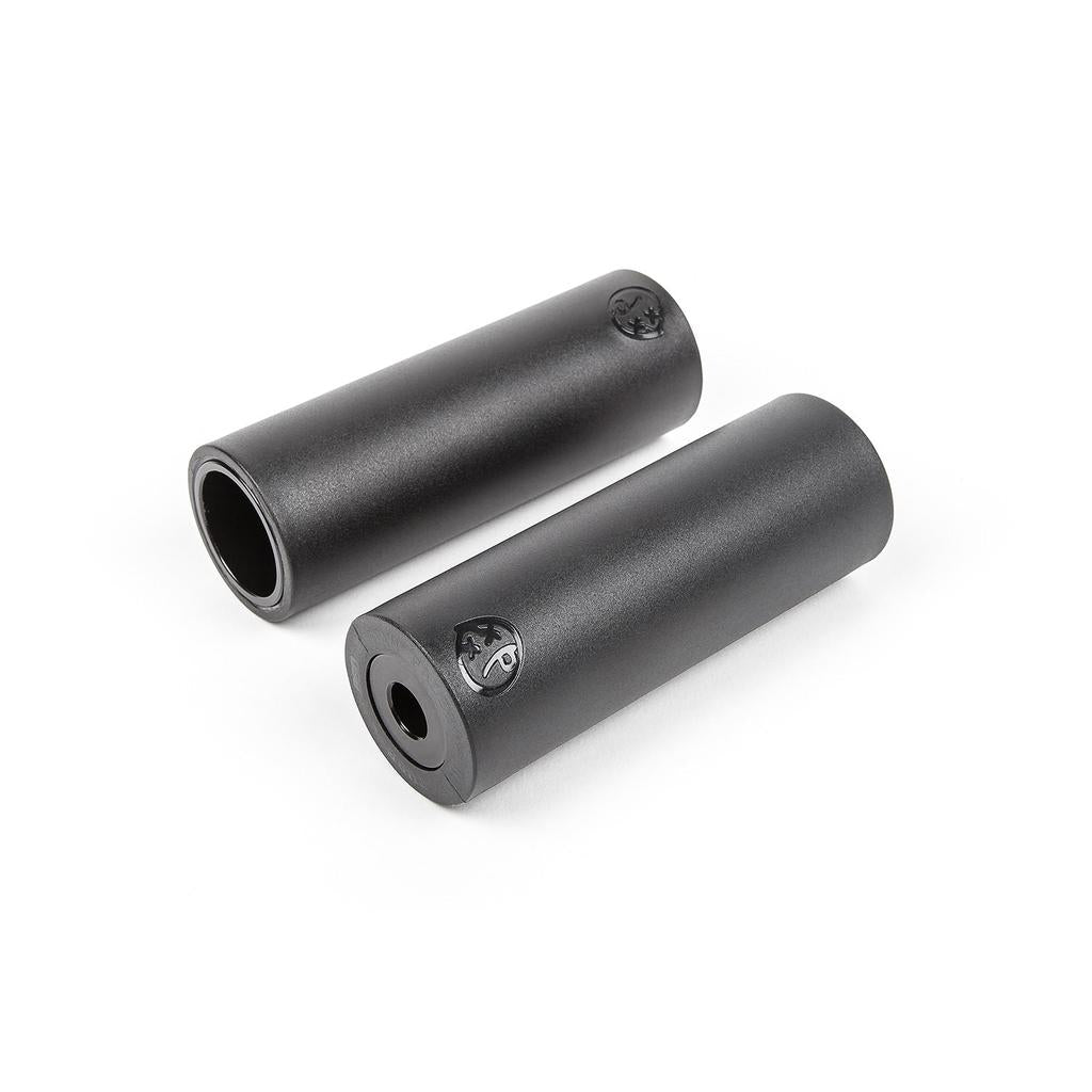Two BSD Rude Tube XL Plastic Pegs in black, featuring logo markings and the Dan Paley signature design, are displayed on a white background.