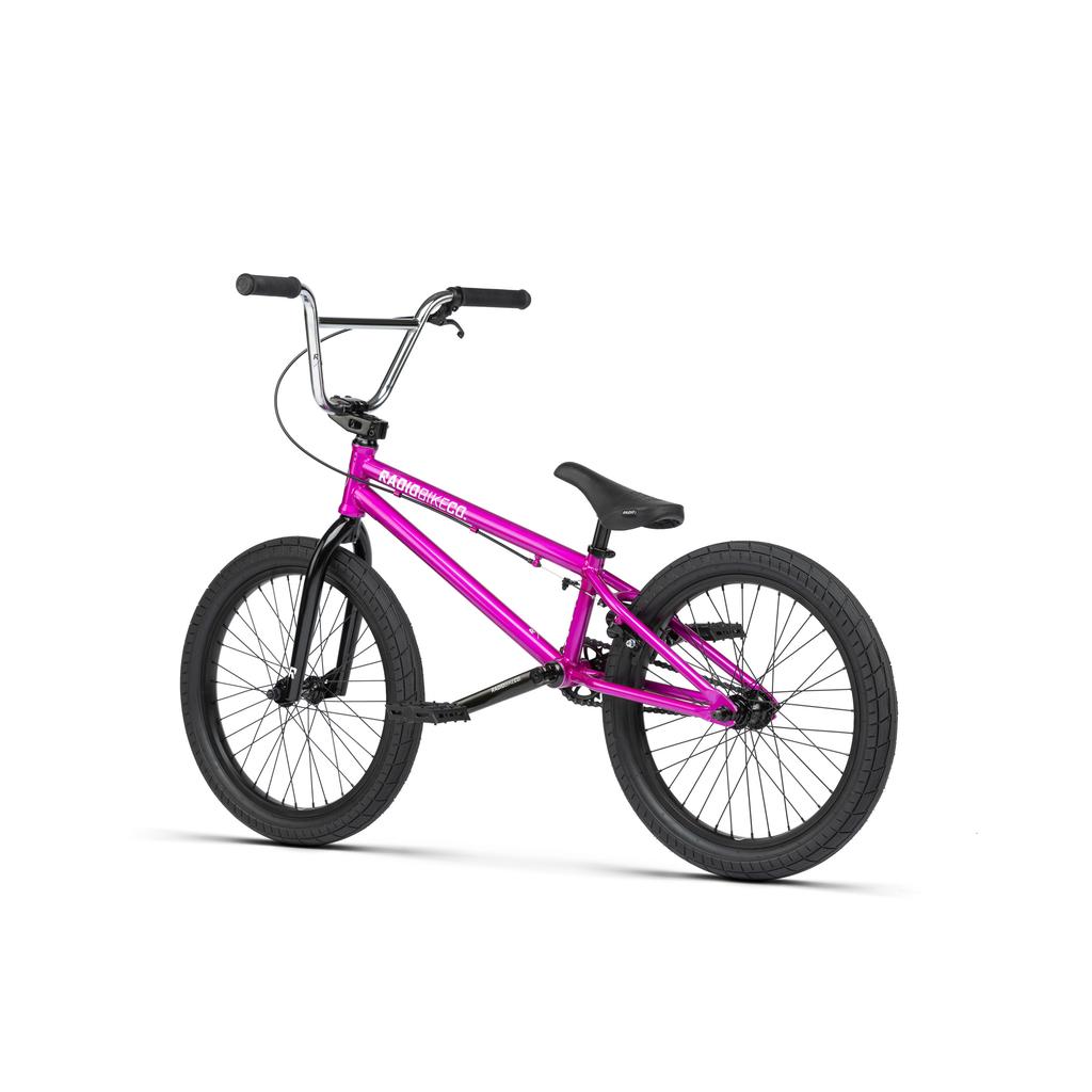 The Radio Saiko 20 Inch Bike is shown from the side against a white background, featuring a magenta frame with black handlebars, seat, pedals, and Salt Tracer Tyres.