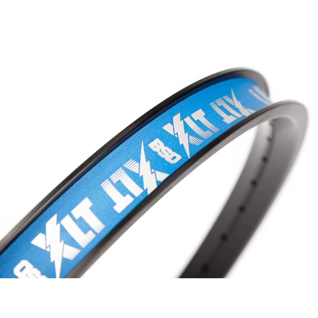 Close-up of the BSD XLT Rim featuring blue rim tape with white text and lightning bolt graphics, wrapped around a durable bicycle rim for enhanced strength.