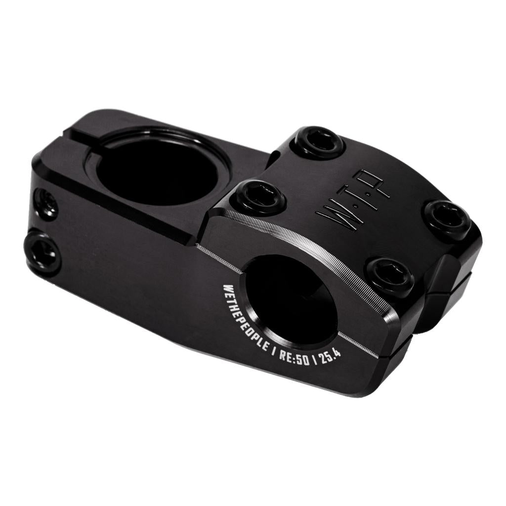 The Wethepeople Logic Oversized Top Load Stem (25.4mm clamp) is a black, machined BMX stem with Shark Tooth Clamping, "WTP" and "WETHEPEOPLE | RE:50 | 25.4" engraving, and four bolt holes for a secure fit.
