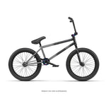 Side view of a black Radio Comrad 20 inch Bike featuring thick tires, upright handlebars, full chromoly frame, and padded seat on a white background.