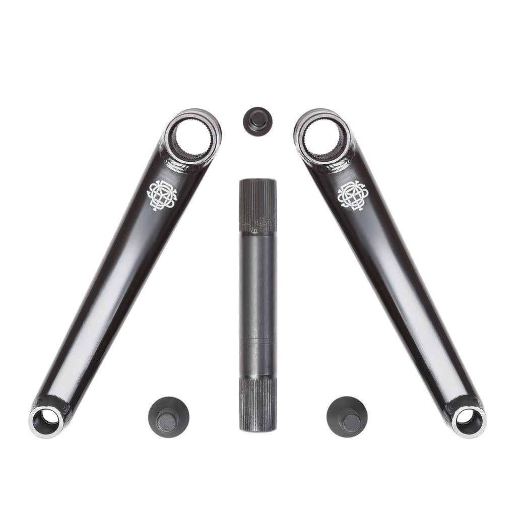 The Odyssey Calibur V2 Cranks feature two black 4130 chromoly crank arms with logos angled towards a central metal spindle. Four circular end caps enhance the sleek, durable design, all set against a plain white background.