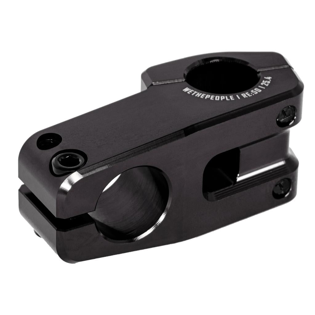 The Wethepeople Logic Oversized Top Load Stem (25.4mm Clamp) is a black BMX stem with precision-cut edges, Shark Tooth Clamping tech, dual clamp bolt areas, and "WETHEPEOPLE | RE:50 25.4" engraved on top.