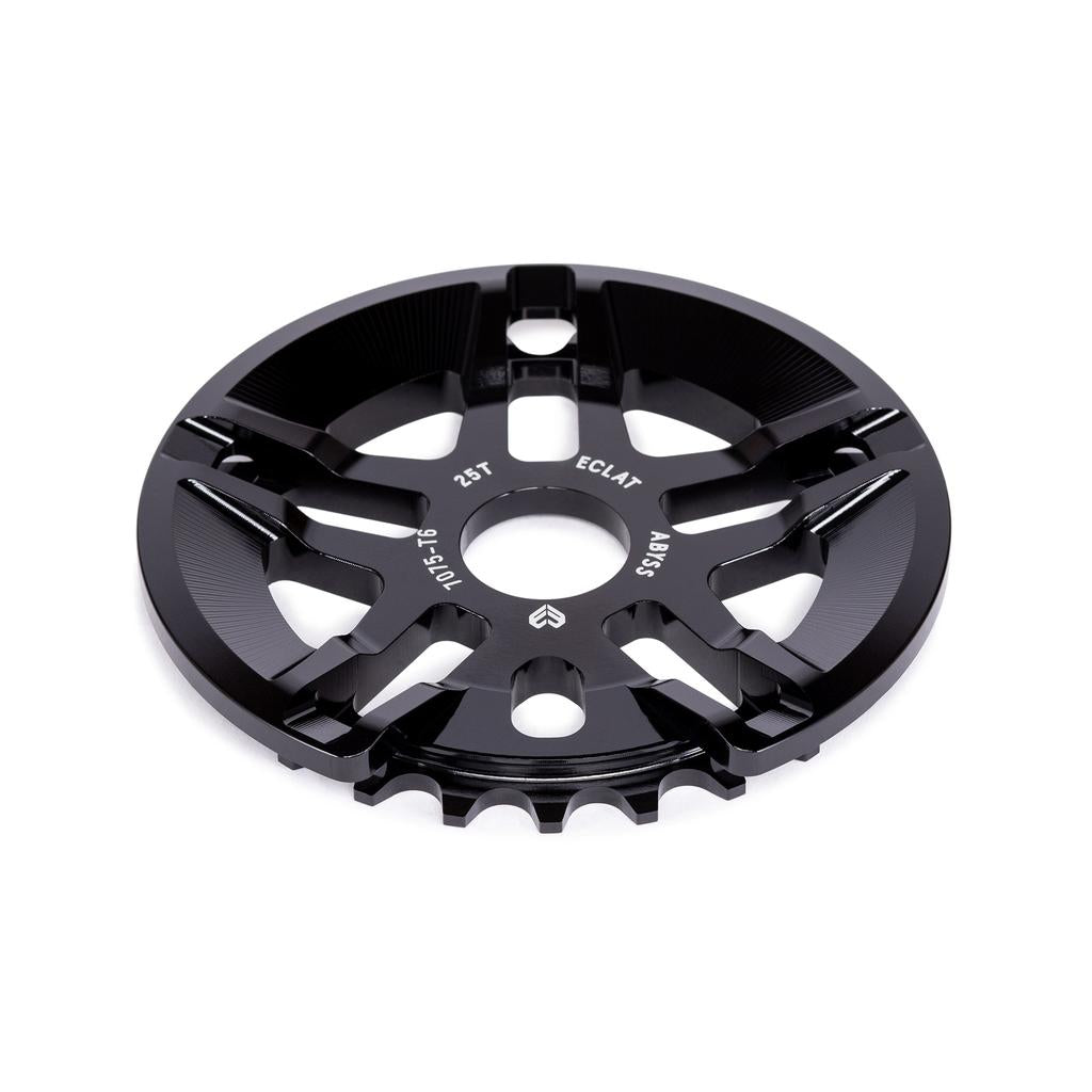 The Eclat Abyss Guard Sprocket, a black metal BMX sprocket labeled “25T” and “Eclat,” features a built-in guard and is crafted from durable 7075-T6 alloy, shown against a white background.