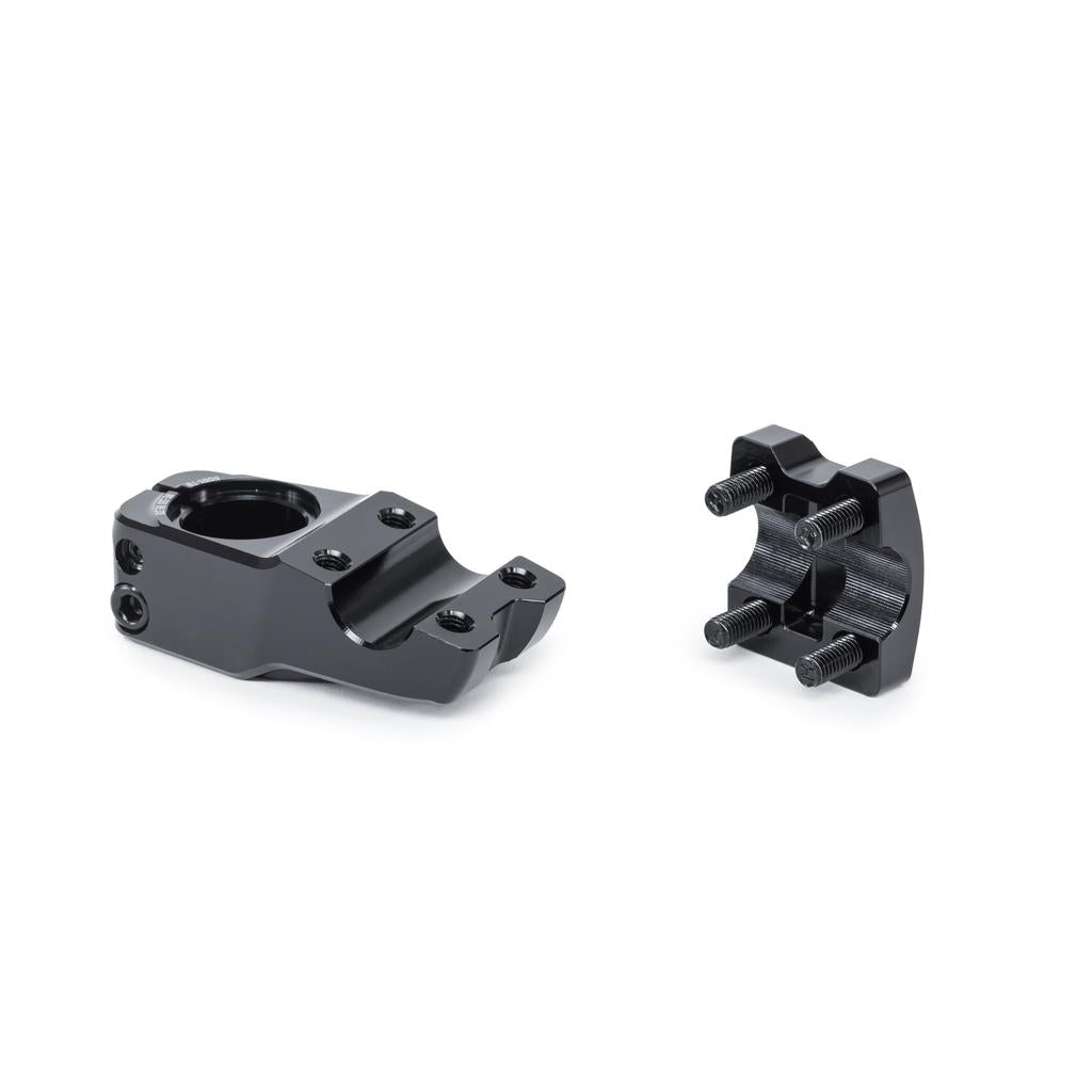 The Wethepeople Hydra Stem (25.4mm Clamp) in black metal, featuring a detachable faceplate with Shark Tooth Clamping and four mounting bolts, is displayed on a white background.