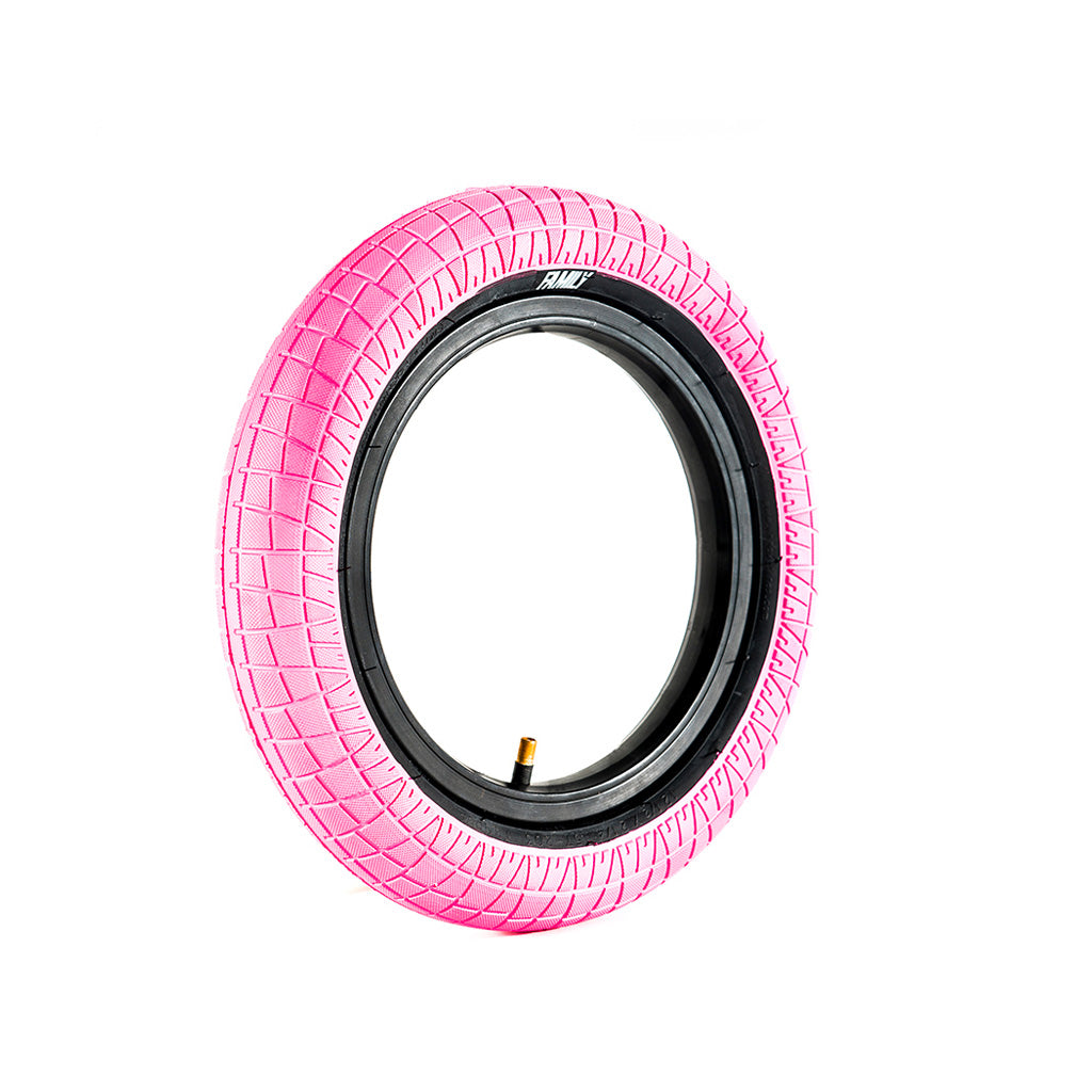 A pink Family BMX F2128 12 Inch Tyre on a white background, perfect for riding.
