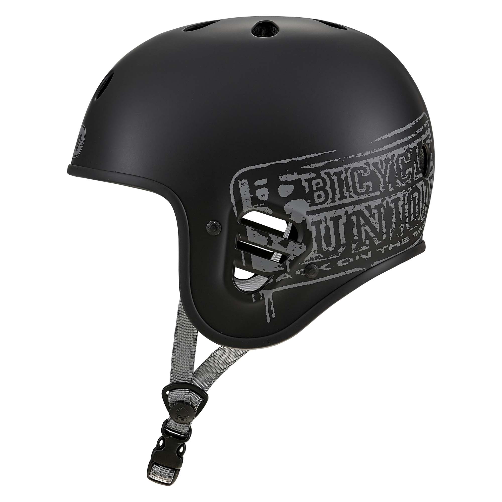 Matte black Protec Full Cut Helmet / Bicycle Union Signature displayed from a side angle, showcasing its gray graphic design, high-impact ABS shell, ventilation holes, and adjustable chin strap—an ideal helmet for action sports.