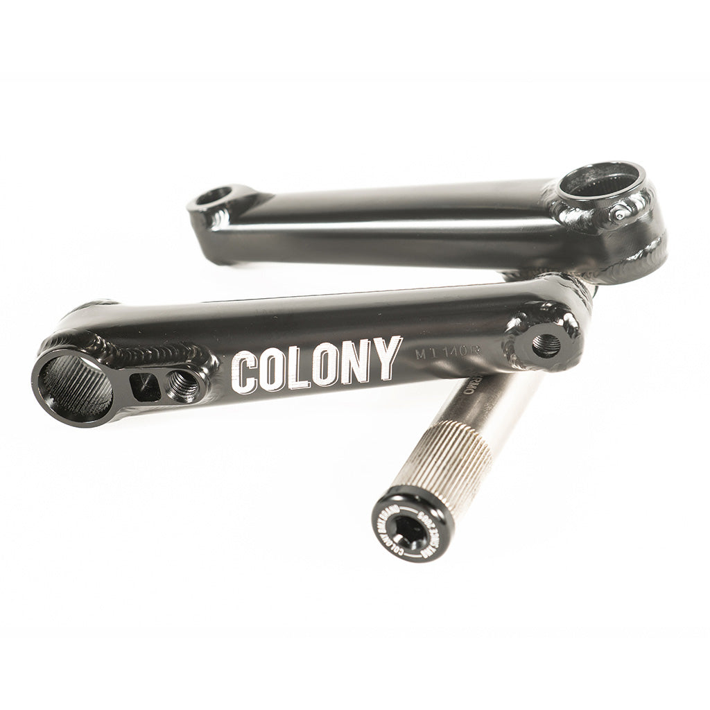 A pair of black Colony Venator 140mm Cranks (Suit 18" Wheeled Bikes) handlebars with the word colony and durability on them.