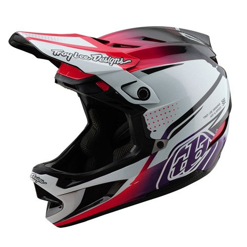 The TLD 25.1 D4 Carbon Helmet (MIPS) / Drip White is a full-face motocross helmet, perfect for downhill BMX adventures. It features a visor, air vents, and a striking red, white, and black design with a bold side logo for enhanced style and performance.