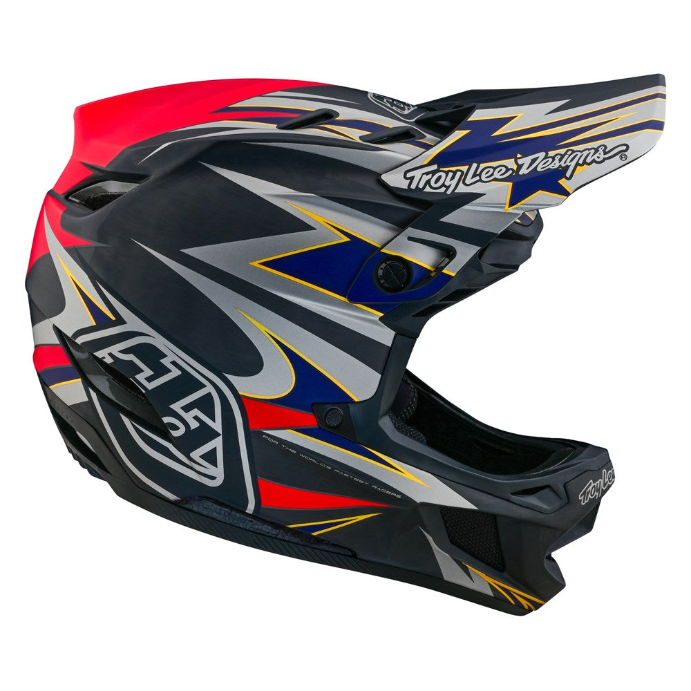 A TLD D4 Carbon AS Helmet W/MIPS Inferno Grey with a red, blue, and black design.
