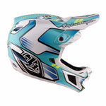 The TLD 26.1 D4 AS Composite Helmet / Crest Real Teal is a BMX helmet in white, blue, and teal with geometric patterns, "Troy Lee Designs" on the visor, and advanced Mips protection for enhanced safety.