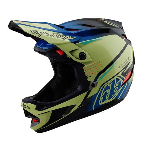 The TLD 25.1 D4 Composite Helmet (MIPS) in Glo Yellow is a vibrant BMX racing helmet featuring blue and green geometric patterns, a visor, and ventilation ports for optimal airflow, branded with "Troy Lee Designs.