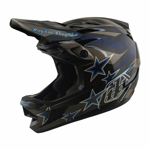 The TLD 26.2 D4 Composite Helmet / MIPS Burst Grey is a black and blue full-face helmet with star patterns and the “Troy Lee Designs” logo on the visor, shown in a side profile view. Inspired by motocross, this mountain biking helmet features advanced Mips protection for enhanced safety.