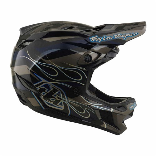The TLD 26.2 D4 Composite Helmet / MIPS Burst Grey is a black and gray full-face helmet featuring striking blue flame graphics, a “Troy Lee Designs” logo on the visor, and advanced Mips protection for enhanced safety.