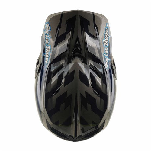 The TLD 26.2 D4 Composite Helmet / MIPS Burst Grey is a black and gray full-face mountain biking helmet, shown from a top-down view, with striking blue “Troy Lee Designs” logos on each side and advanced Mips protection for enhanced safety on the trails.