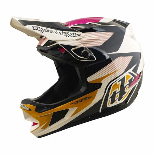 The TLD D4 Polyacrylite Helmet in the Turbo Acid/Fuchsia colorway is a full-face helmet built for motocross and mountain biking, featuring a visor and bold black, white, pink, and gold geometric patterns with the number 55 on the side. Designed with advanced Mips brain protection technology, this helmet provides enhanced safety on every ride.
