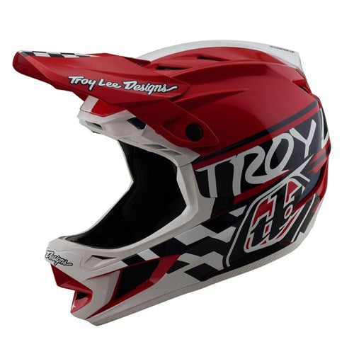 The TLD D4 Polyacrylite Helmet (MIPS) in Fifty-50 White/Red features a full-face design with the "Troy Lee Designs" logo and geometric patterns, crafted for motocross and BMX, and includes Mips® C2 technology for improved safety.