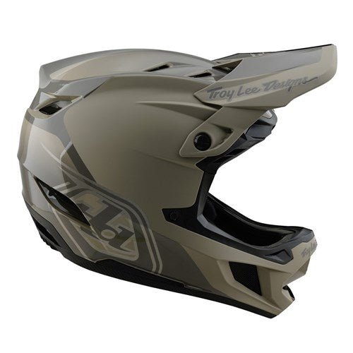 The TLD D4 Polyacrylite Helmet (MIPS) in Shadow Timber is a matte gray full-face helmet with a polyacrylite shell and visor, featuring "Troy Lee Designs" on the side and top, and includes Mips brain protection for enhanced safety.