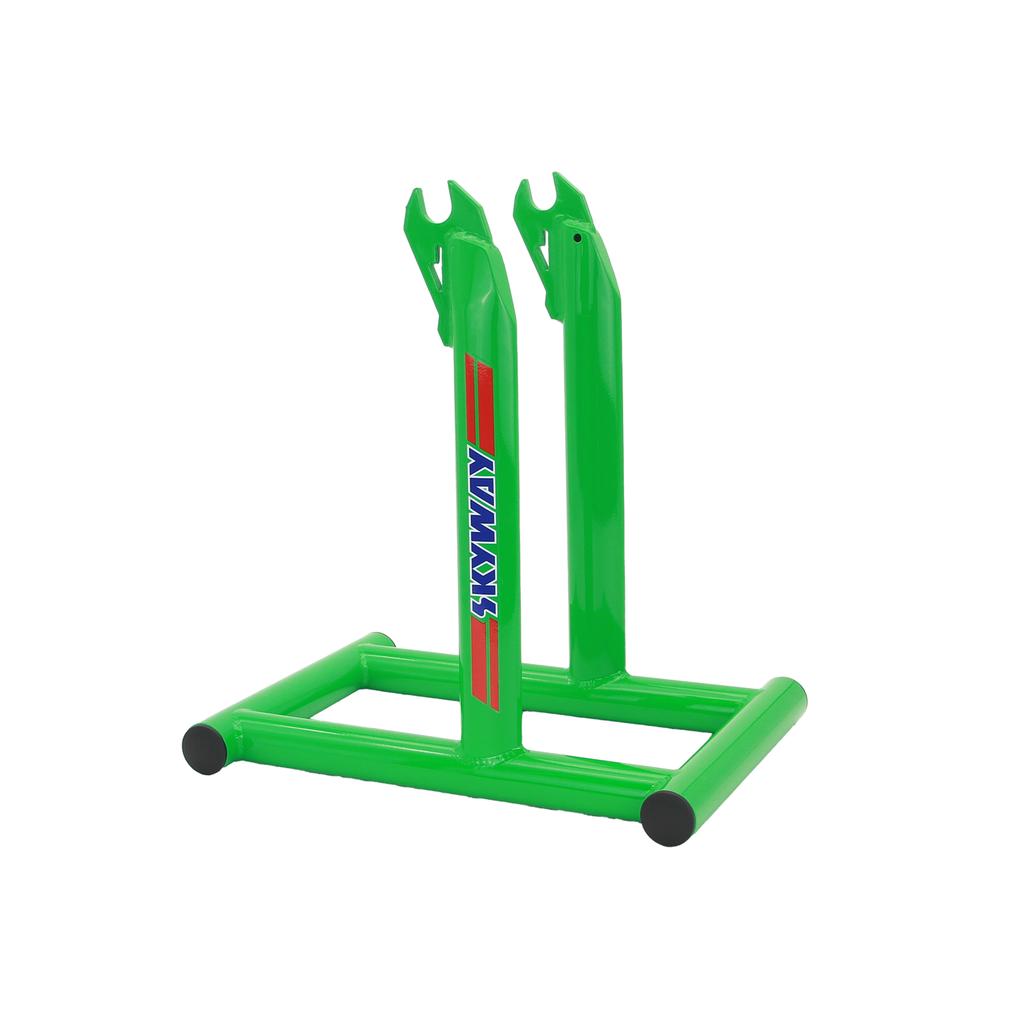 A green metal Skyway Stolz Stand with two vertical arms and black end caps, "Stowaway" in blue on one side—ideal for any Skyway TA Replica setup.