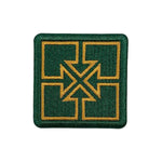 The Fit Bike Co Key Embroided Patch is a green square patch with a satin border, featuring four gold-outlined rectangles and crossed arrows forming an X shape in the center.