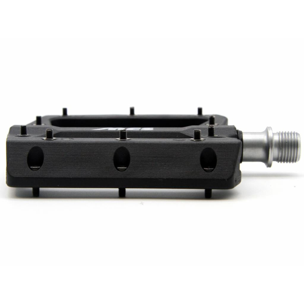 MCS Sealed Pedals feature a black platform with metal grip pins, a silver spindle, and sealed bearing construction, shown on a white background.