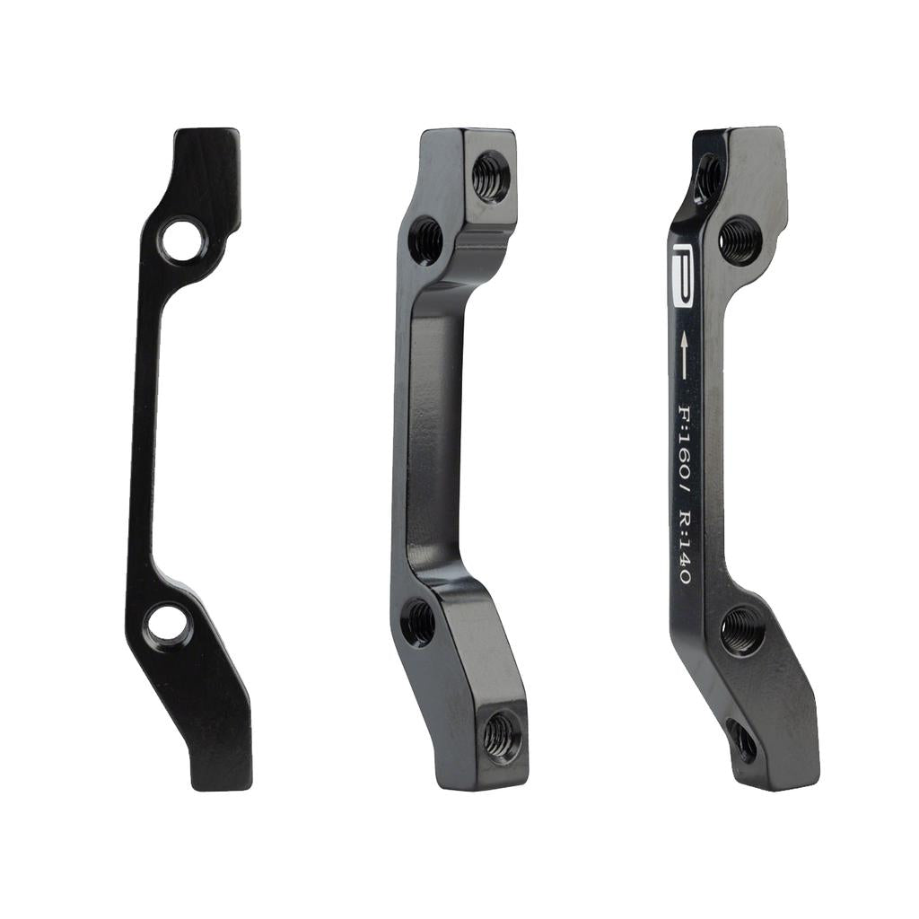 Three views of the Promax PM for IS Disc Brake Adaptor in black aluminium alloy, showing mounting holes and engraved markings for front 180mm or rear 140mm rotor compatibility.